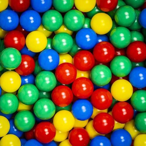 A close-up view of colorful ball pit balls in red, blue, green, and yellow, perfect for play areas and indoor playgrounds.
